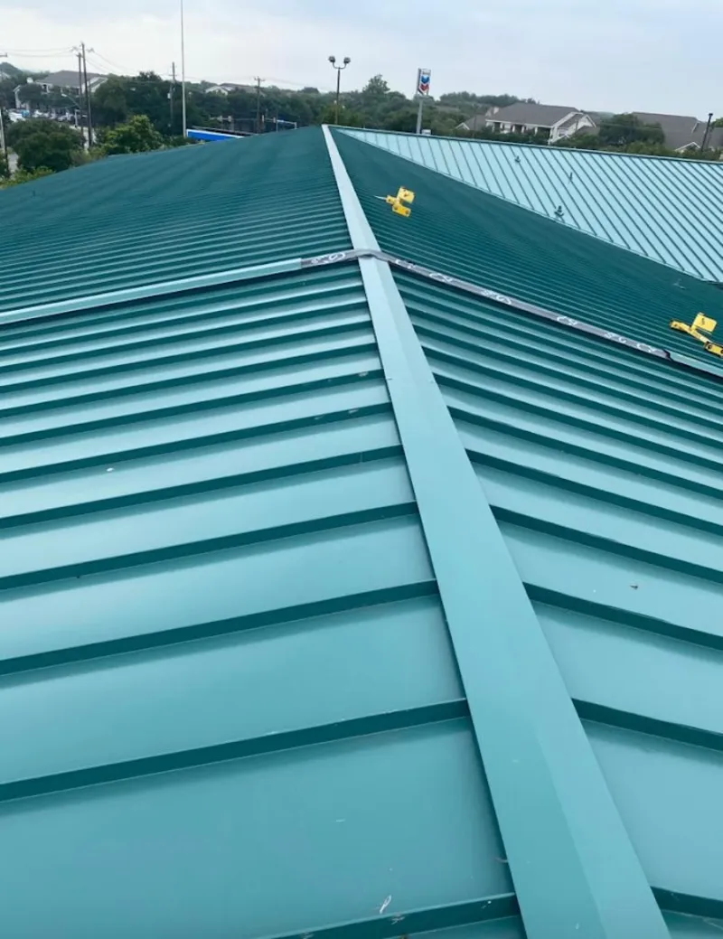 Green commercial metal roof ridge and valley for Metal Roof Repair in Fulshear